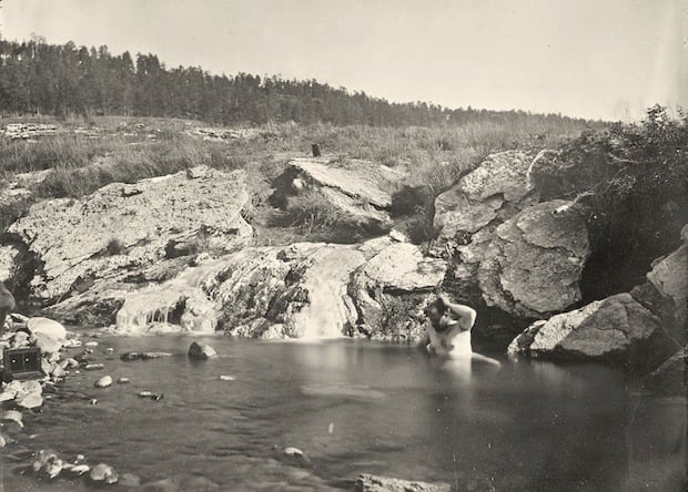 Man bathing in Pagosa Hot Spring, Colorado. Taken in 1874.