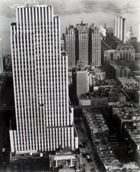 Daily News Building, 42nd Street between Second and Third Avenues, Manhattan. Looking toward East River from tall building, News Bldg., brownstones, the Con Edison plant and an apartment building.