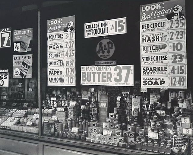 A & P (Great Atlantic & Pacific Tea Co.), 246 Third Avenue, Manhattan. Window display showing can goods, eggs, crackers, etc. and signs for sale items, ads with Kate Smith inviting you to try 2 different coffees.