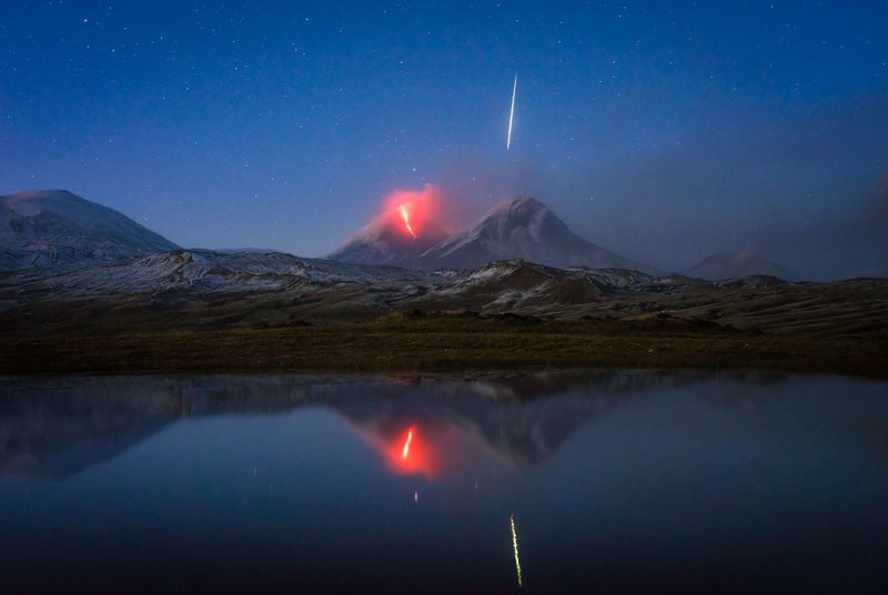 Photographer Snaps Streaking Meteor Above an Erupting Volcano