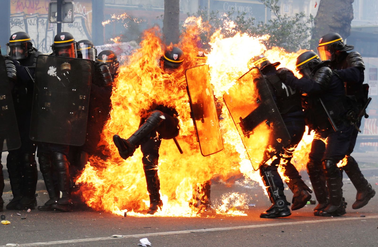 The Story Behind this Viral Photo of a French Policeman on Fire