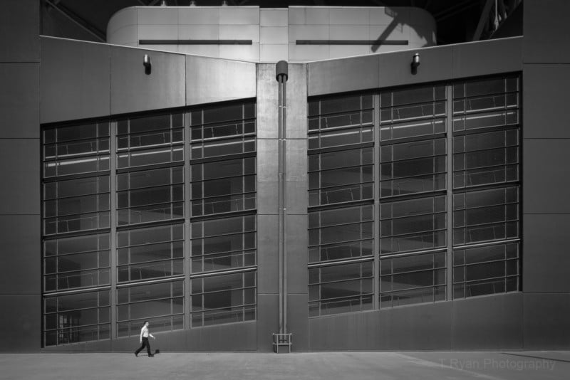 Photos of Tiny, Lone Figures Dwarfed by Large Buildings