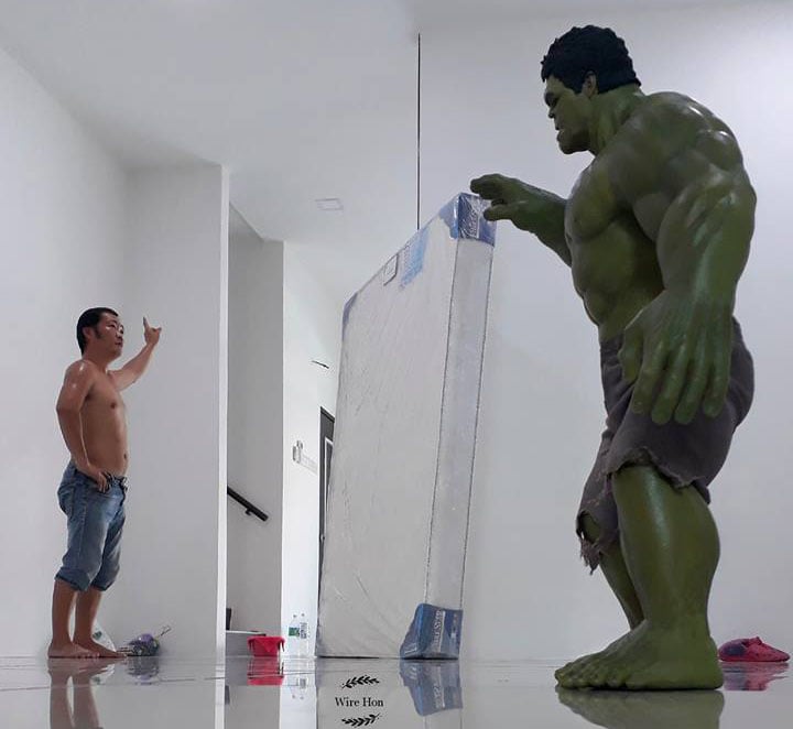 This Guy Poses with Toy Superheroes Using Forced Perspective