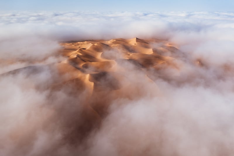 Beautiful Aerial Photo Captures the Liwa Desert Emerging from the Fog