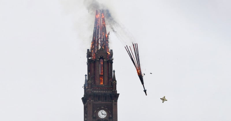  photographer captures striking shot flaming church steeple collapsing 