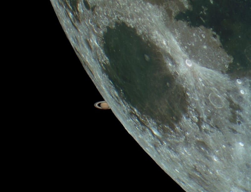 Heres a Photo of Saturn Peeking Out from Behind the Moon
