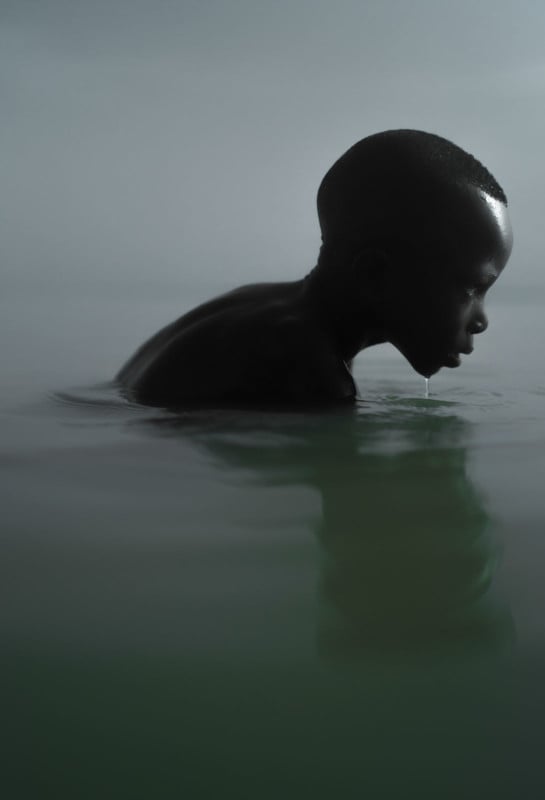 Photographer Shoots Dark Portraits of Boys Fishing on Ghanas Lake Volta