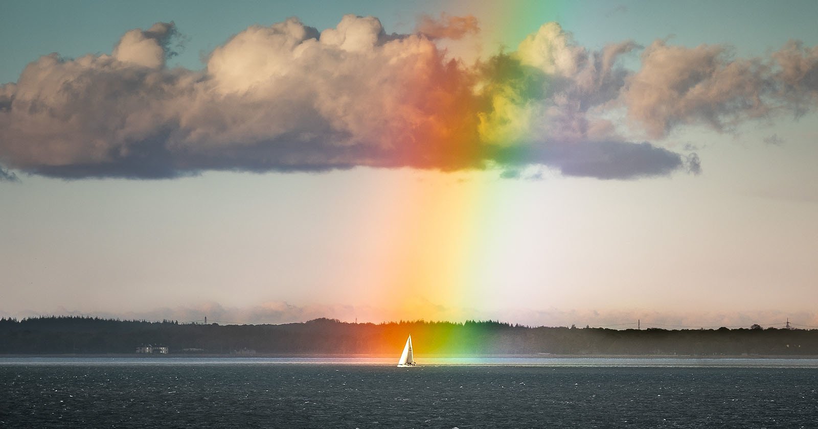 Photographer Captures Sailboat at the End of a Rainbow