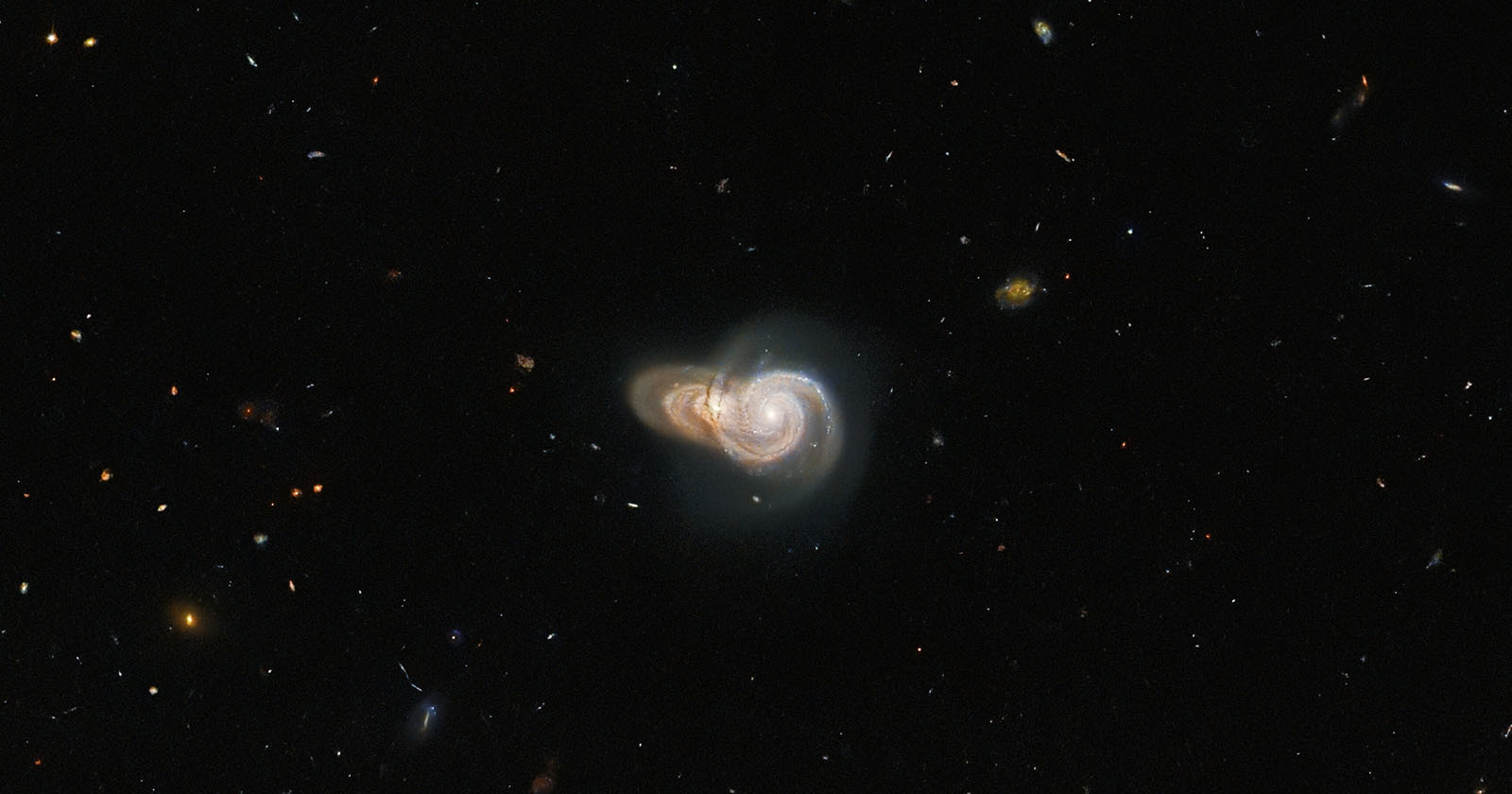  hubble captures optical illusion two spiral galaxies colliding 