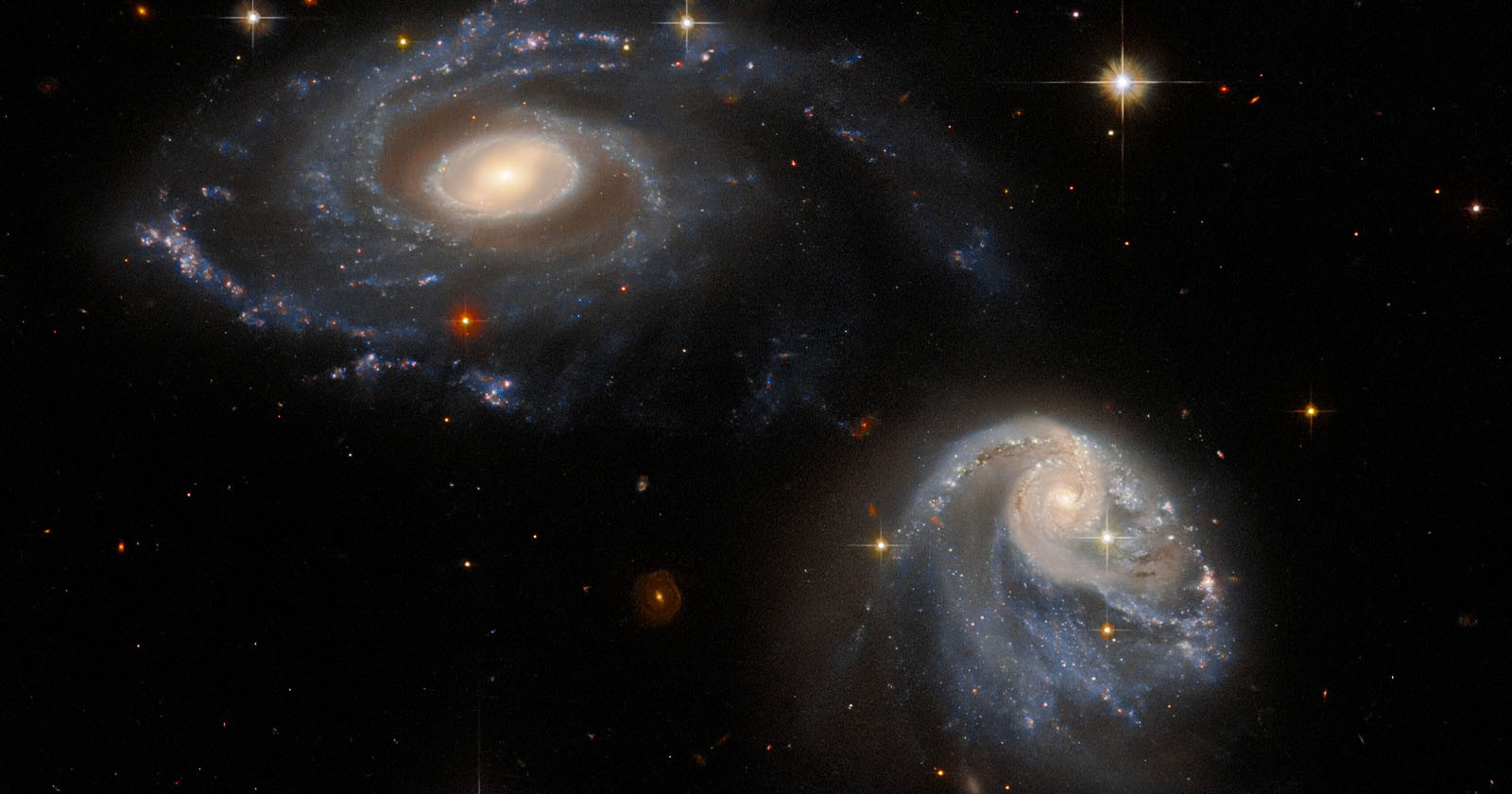 Hubble Photographs Two Galaxies Warped by Each Others Gravity