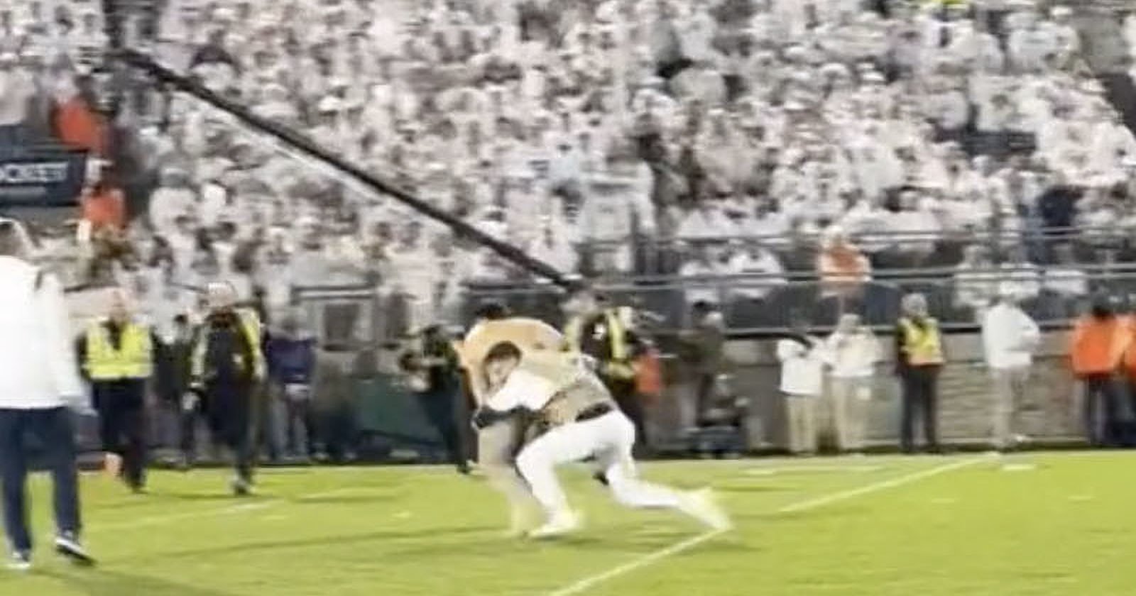 Photographer Tackles Fan Who Ran on Field During College Football Game
