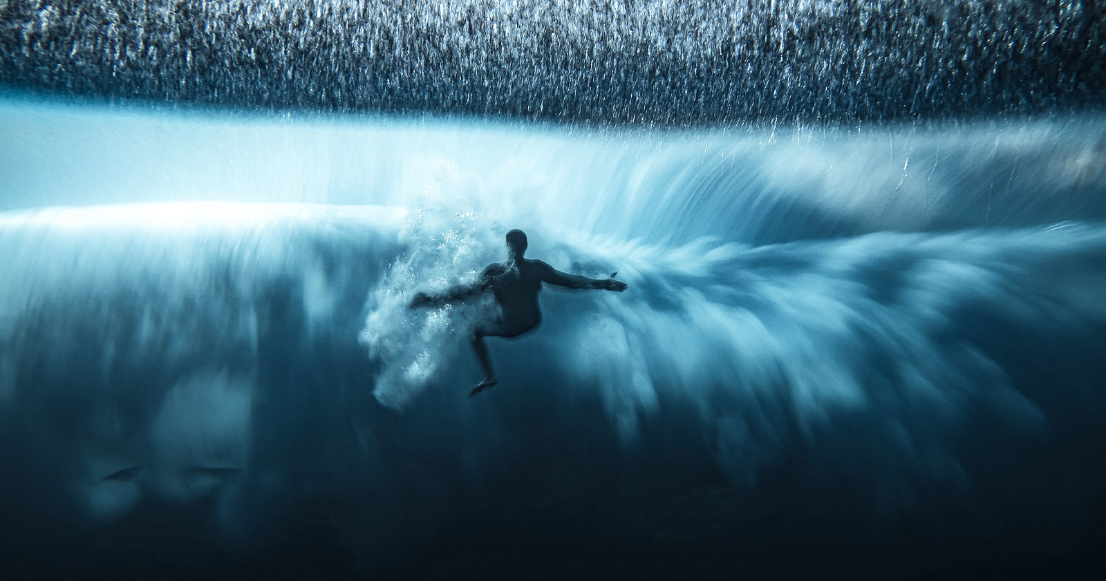 Photo of Surfer Held Down by Wave Wins Ocean Photographer of the Year