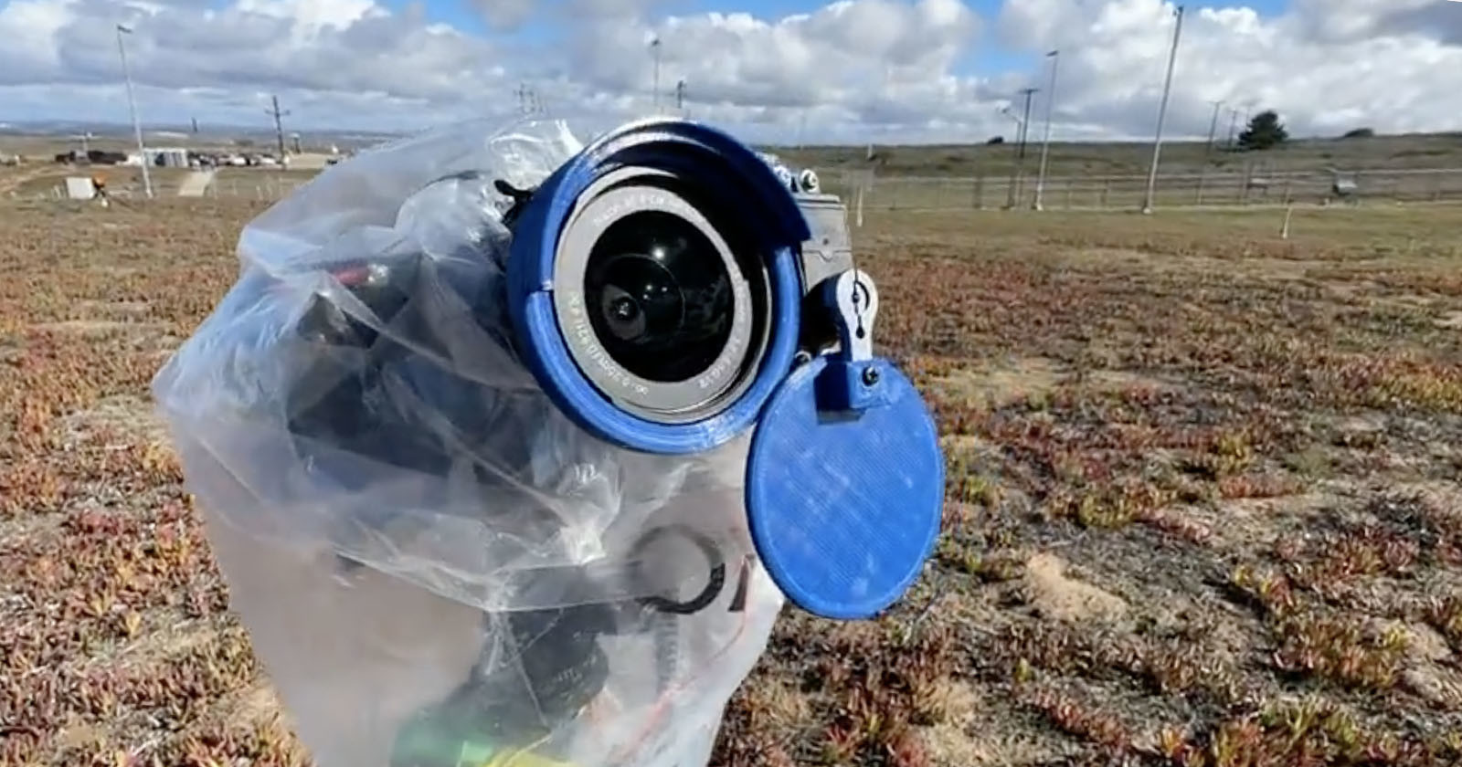  photographer automatic lens cap shields camera during rocket 