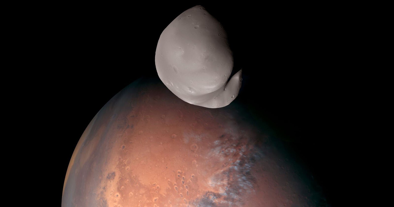  space probe captures detailed mars moon deimos 
