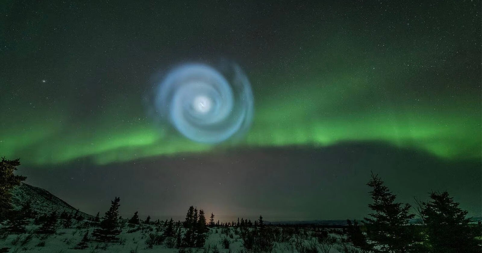 Giant Spiral Appears Amid the Aurora Lights in Alaskas Night Sky