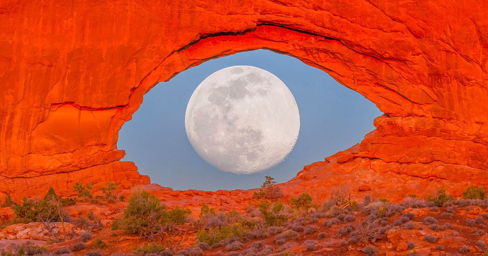 Image of Full Moon Through a Rock Formation Looks Like a Giant Eye