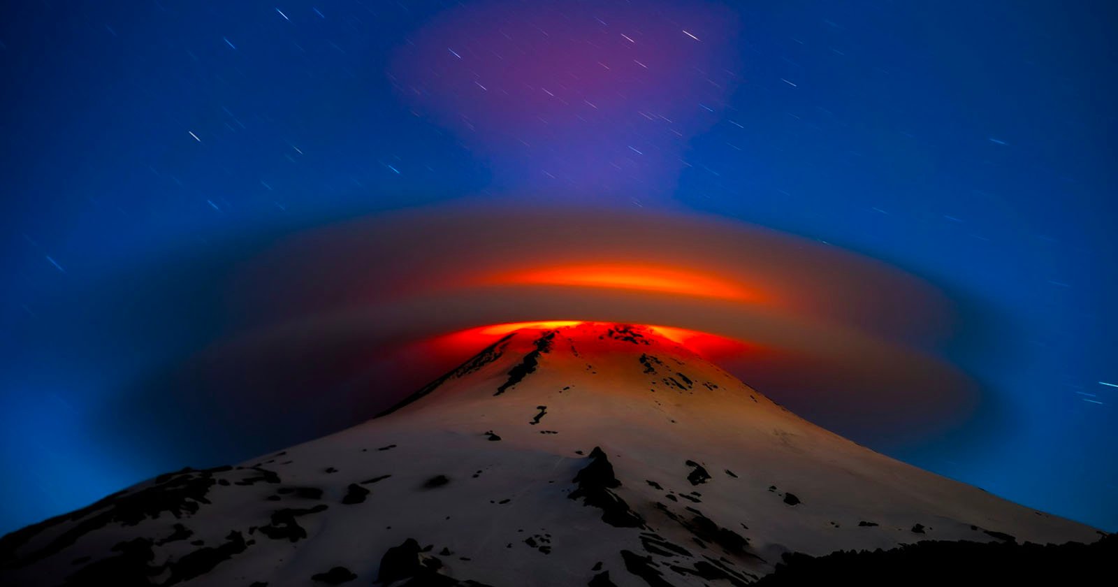 Photo of a Volcano Glowing Inside a Cloud Wins Weather Photographer of the Year