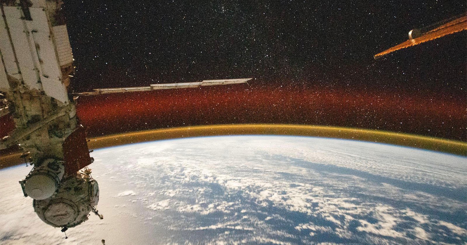  iss captures earth glowing golden magnificent photo 