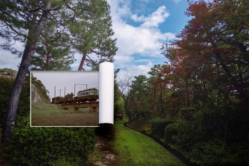 A large photo print of a black-and-white urban scene is unrolling over a vibrant, green forest path, blending the city image into the colorful natural landscape under a blue sky with clouds.