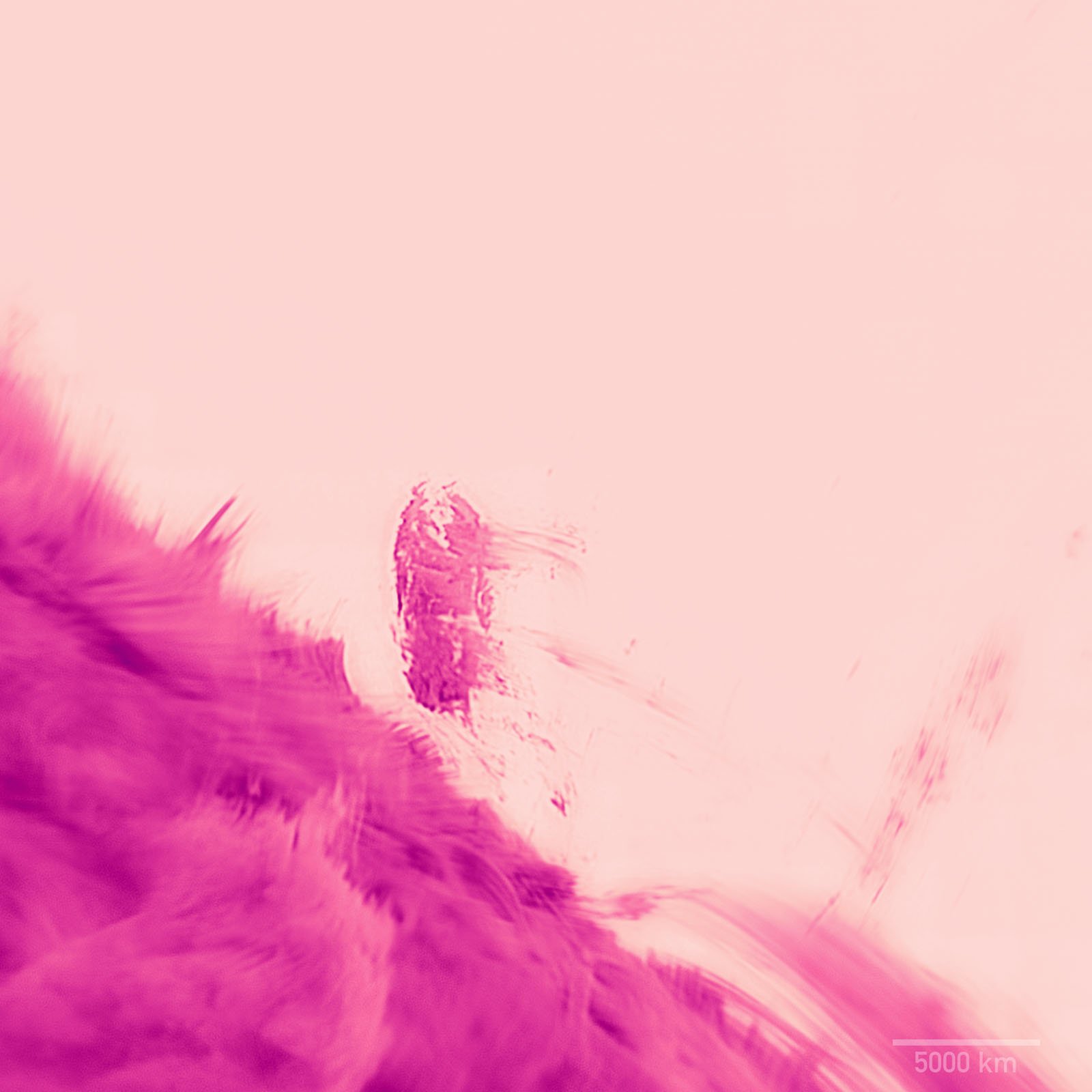 A pink-tinted image shows a blurry, vertical column-like structure emerging from a textured surface, with a scale marker indicating 5000 km in the bottom right corner.