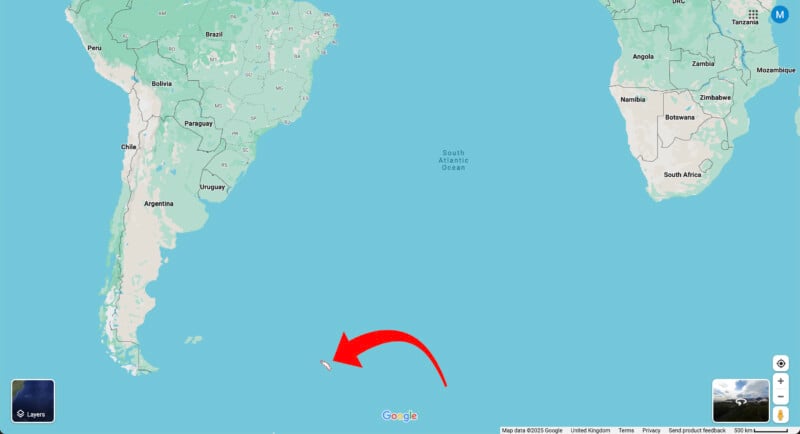 A map shows the southern tip of South America and part of Africa, with a large red arrow pointing to an island in the South Atlantic Ocean near the Falkland Islands.