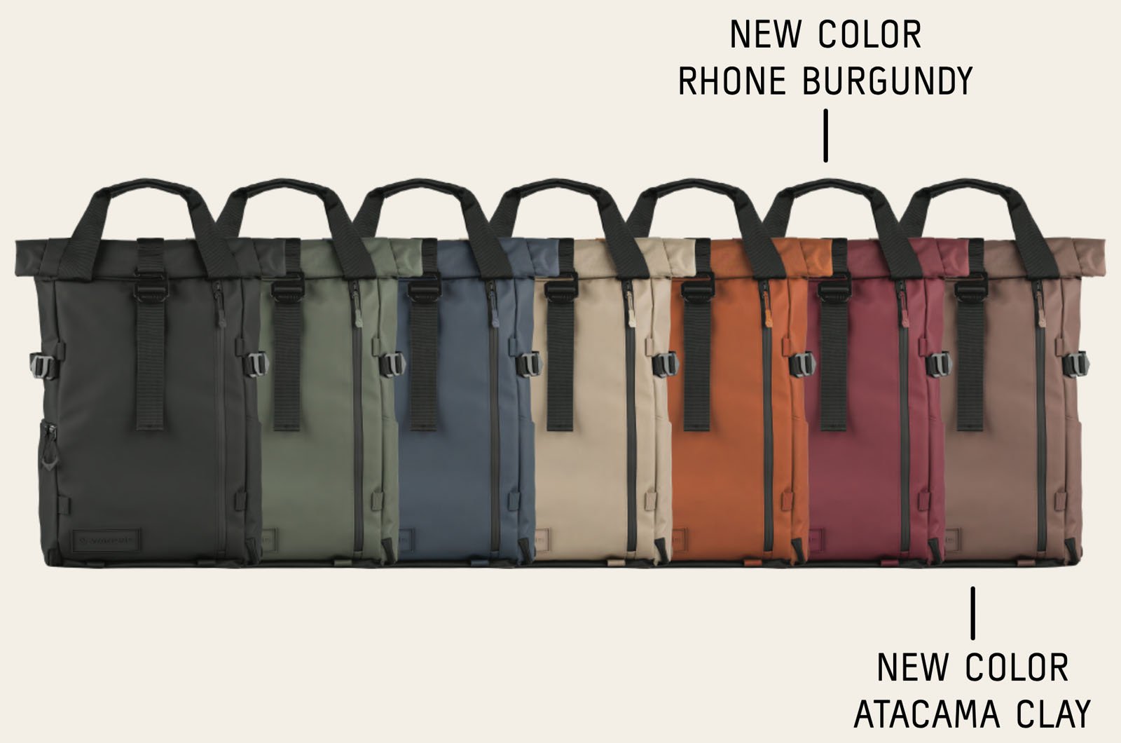 A lineup of seven rolltop backpacks in various colors, including black, green, blue, beige, burgundy, red, and brown; text highlights the new colors Rhone Burgundy and Atacama Clay.