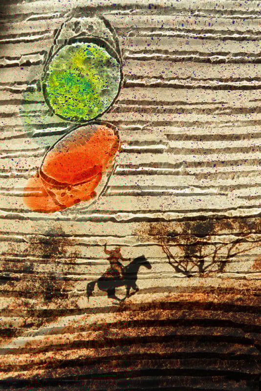 A textured artwork shows a cowboy on horseback riding past trees, with two colorful, translucent shapes (green and orange) hovering above, creating a surreal landscape effect.