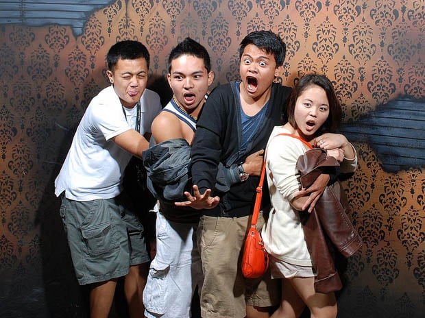 scared people in haunted house