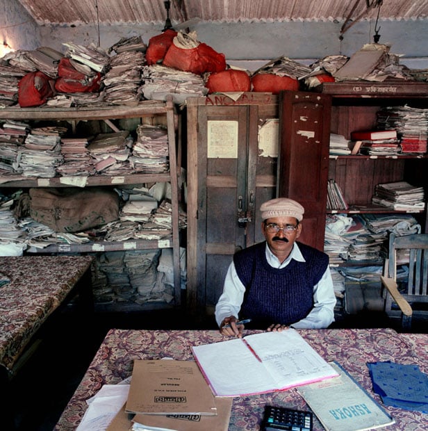 India, bureaucracy, Bihar, 2003. India-19/2003 [Tha, SKM (b. 1946)]. Surinder Kumar Mandal (b. 1946) is circle inspector of taxes in Thakurganj block, collecting taxes in a specific part of Kishanganj district, State of Bihar. Monthly salary: 9,500 rupees ($ 208, 189 euro). Surinder Kumar Mandal (b. 1946) is "circle inspector" van belastingen in Thakurganj Block, Kishanganj district, State of Bihar. Maandsalaris: 9,500 rupees (euro 189, US$ 208).