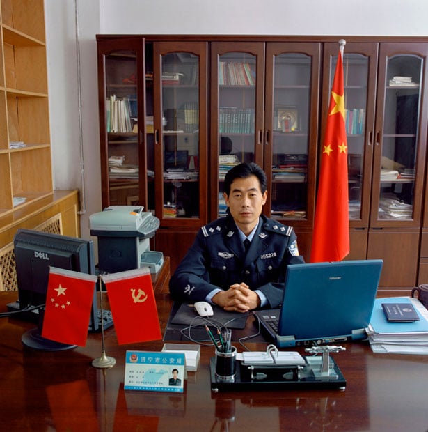 China, bureaucracy, Shandong, 2005. China-06/2007 [Jin., QSF (b. 1964)]. Qu Shao Feng (b. 1964) is chief general of Jining Public Security Bureau Division of Aliens and Exit-Entry Administration in Jining City, Shandong province. Monthly salary: 3,100 renminbi (US$ 384, 286 euro).