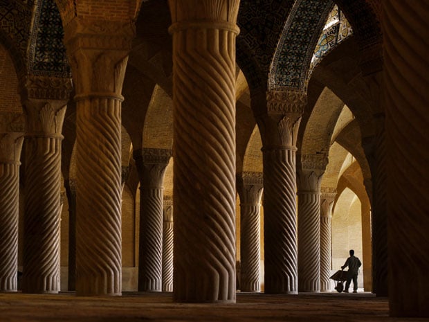 A worker inside Vakil Mosque, Shiraz. The mosque now serves as a tourist attraction but sees only a trickle of visitors. Although tourism is on the increase, western tourists still make up only 10% of the total. One tourist guide said westerners are scared away by the bloodcurdling rhetoric of a government which is completely out of touch with ordinary Iranians.