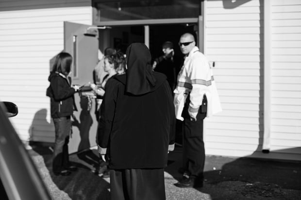 Nun walks into the firehouse, moments before Gov. Malloy broke the initial news to all of the involved families