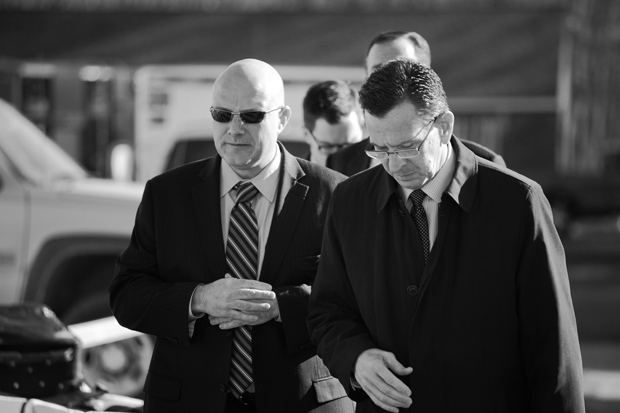 Gov. Malloy, walking towards the firehouse where he is about to personally break the news to all of the affected families for the first time