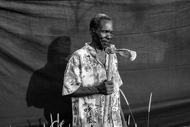 The most important thing Omar was able to bring with him is the axe he holds in this photograph. He used it to cut firewood for cooking and to make small wooden structures where his family could sleep at night, and sometimes to rest for several days at a time, during their journey.