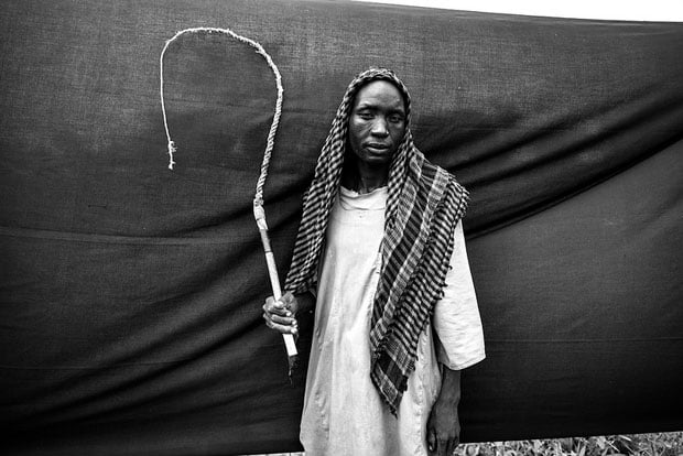 The most important thing Al Haj was able to bring with him is the whip that he holds. Without it, he says, he wouldn't have been able to keep together his herd of 50 goats, and he would now be destitute.