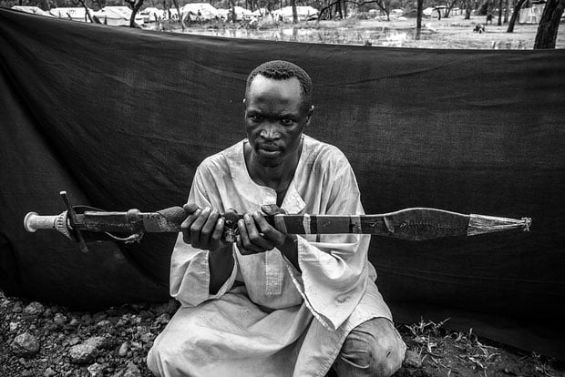 The most important object Howard was able to bring with him is the long knife he holds, called a shefe, which he used to defend his family and his herd of 20 cattle during their 20-day journey from Bau County to the South Sudanese border.