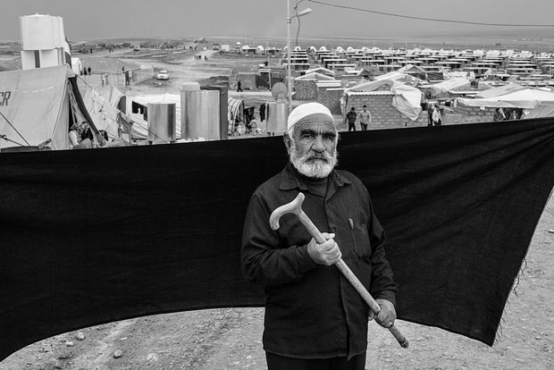 The most important thing Ahmed was able to bring with him is the cane he holds in this photograph. Without it, he says, he would not have made the two-hour crossing on foot to the Iraqi border. "The only other thing I have left is this finger," he said. "All I want now is for my family to find a place where they can be safe and stay there forever. Never should we need to flee again."