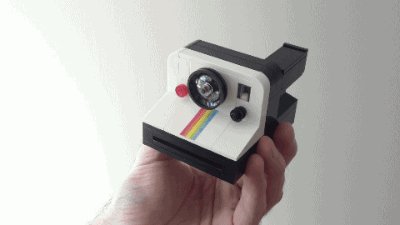 An animated GIF showing how the LEGO camera can spit out an instant photo