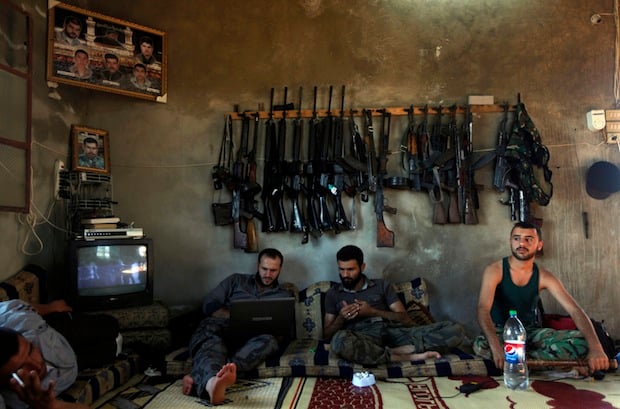 Free Syrian Army fighters resting in a house on the outskirts of Aleppo. (c) Khalil Hamra, AP