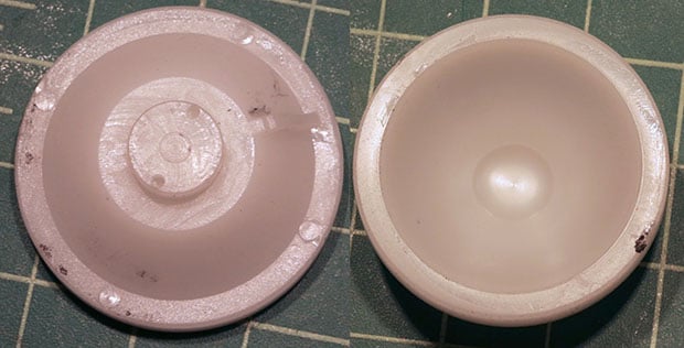 Internal and external views of the plastic bearing cup that fits over the ball