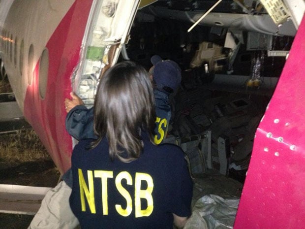 "Chairman Hersman and Investigator-in-Charge Bill English looking at interior damage to #Asiana214"