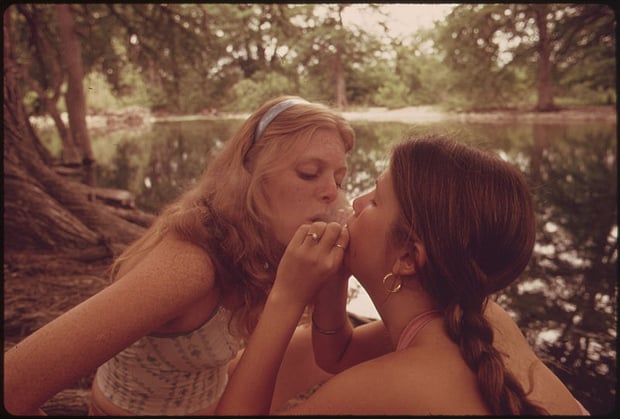 "Two Girls Smoking Pot During an Outing in Cedar Woods near Leakey, Texas," by Marc  St. Gil