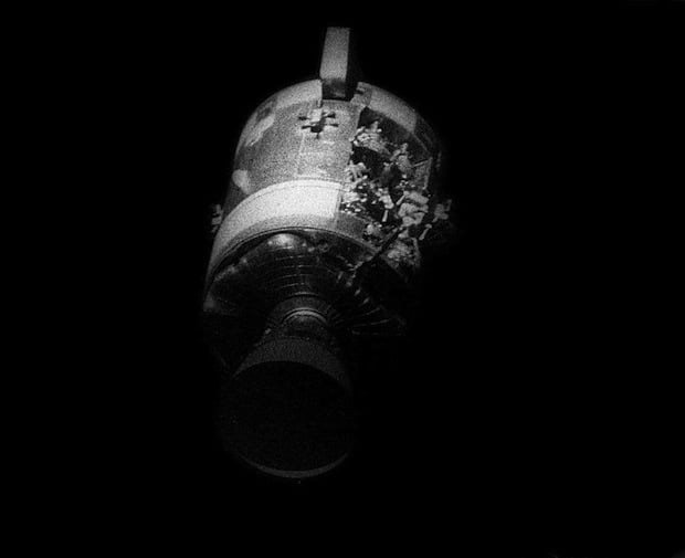 Photograph of the crippled Apollo 13 service module after separation