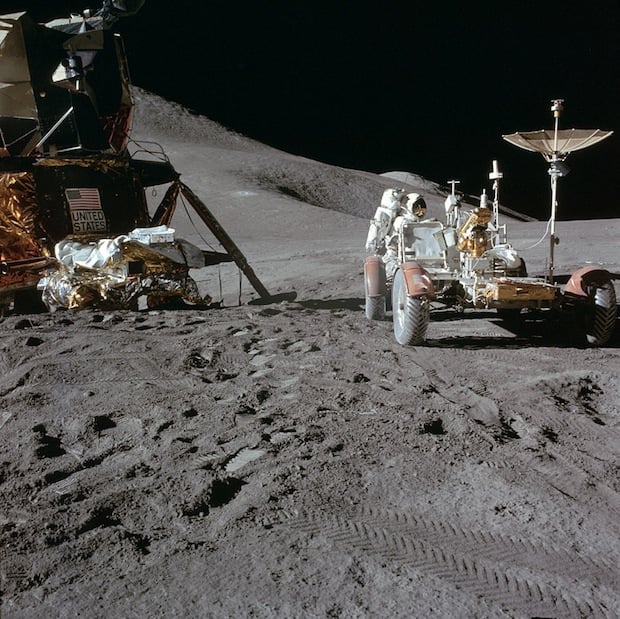 Apollo 15 astronaut Jim Irwin working on the lunar rover.