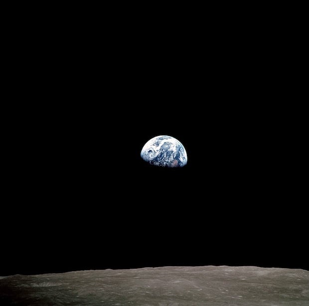 The crew of Apollo 8 photograph the Earth rising over the Moon. They were the first humans ever to witness this incredible phenomenon.