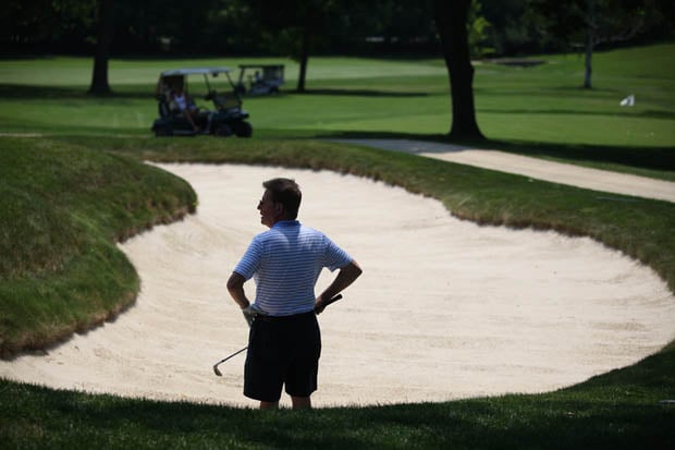 A member of a foursome looks on from a bunker on the ninth hole during the 4th Annual Ahmad Rashad Golf Classic at the Quaker Ridge Golf Club in Scarsdale. (June 24, 2013)