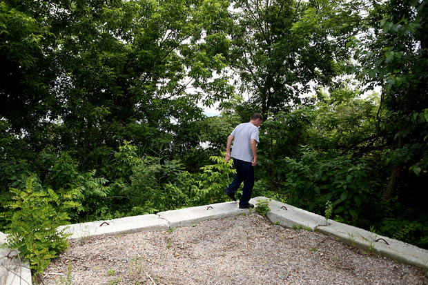 Bill DeGroat, of Stony Point, points to the site of a temporary desalination intake near a proposed site for a new permanent plant intake in Haverstraw along the Hudson River. The previously used intake, ran for multiple years, sat adjunct to the Haverstraw Marina. DeGroat's family has kept a fishing cottage underneath the US Gypsum oring operation, which sits yards from the defunct intake. (June 18, 2013)