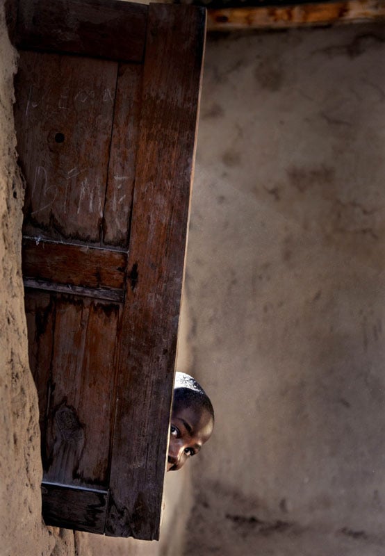 At the village of Cassaunga, a boy peers inside a local church