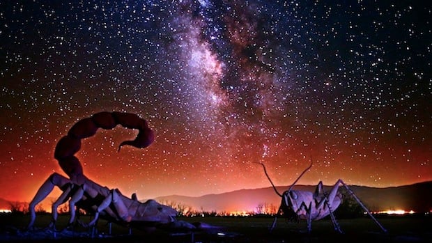 Amazing milky way passes over giant insect statues. Sculptures by Ricardo A Breceda. Photo by Gavin Heffernan.
