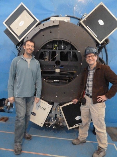 Dr. Jared Males and Professor Laird Close pose with the MagAO system.